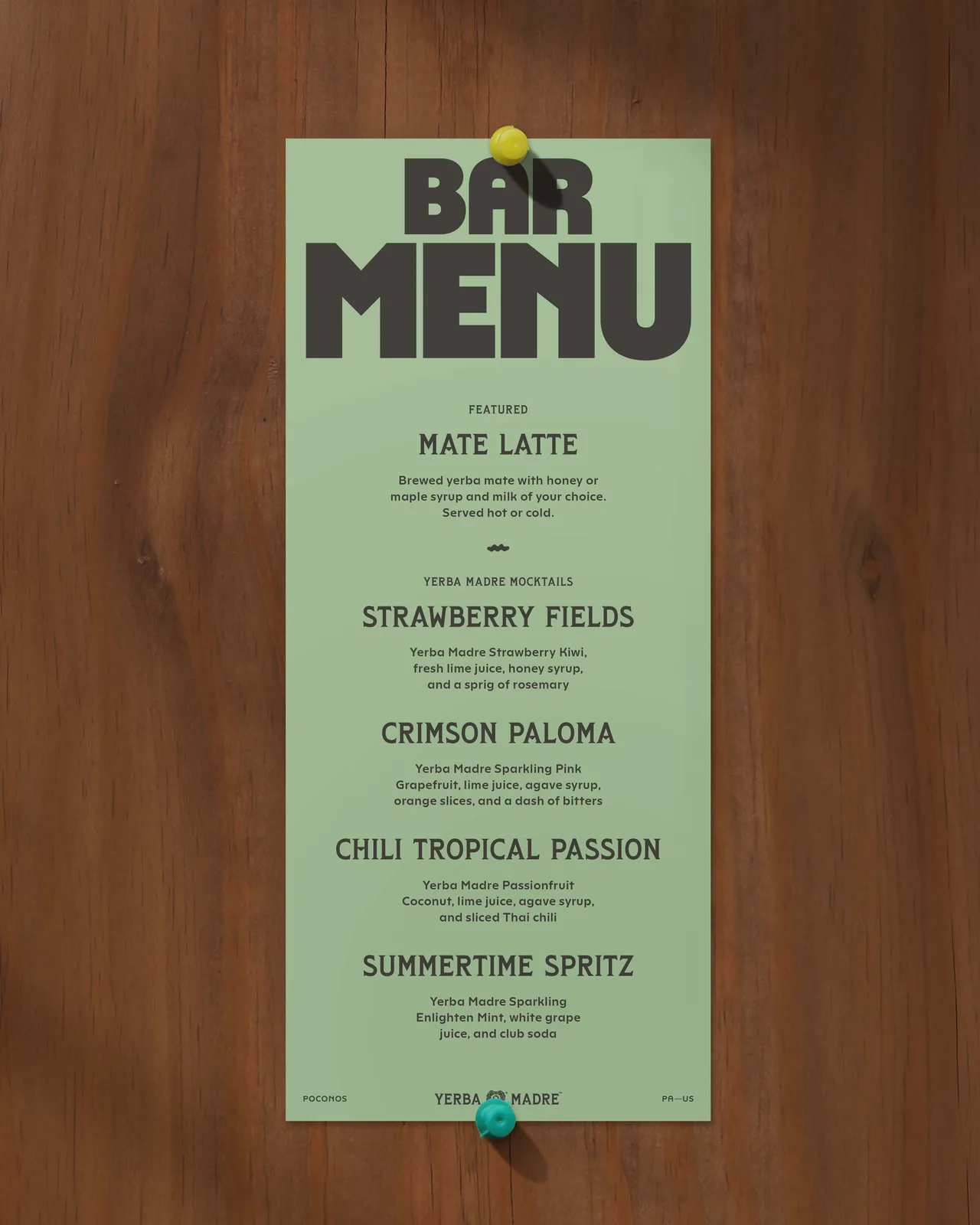 Mint green Camp Yerba bar menu on wood