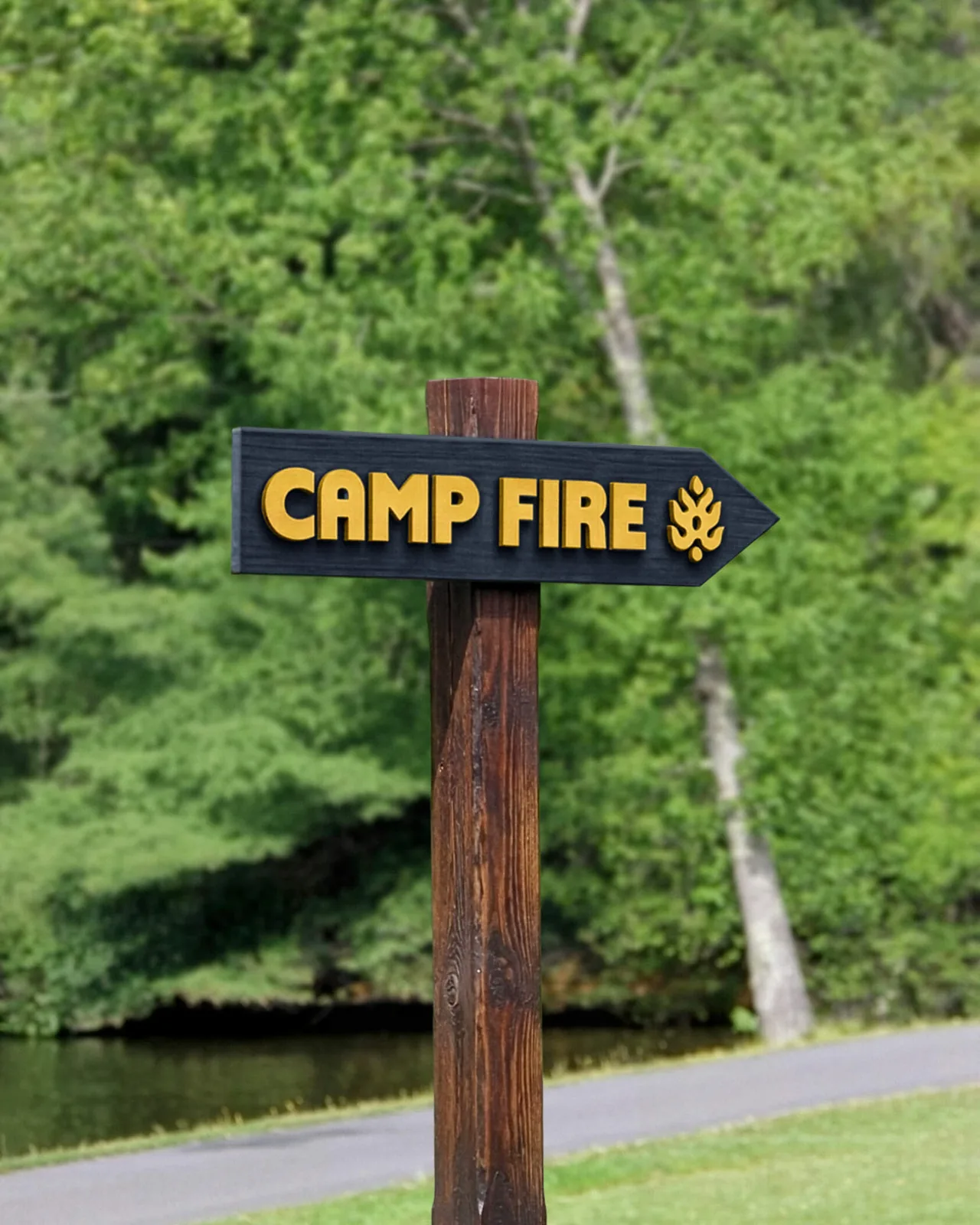 Camp Fire wooden wayfinding sign among the trees