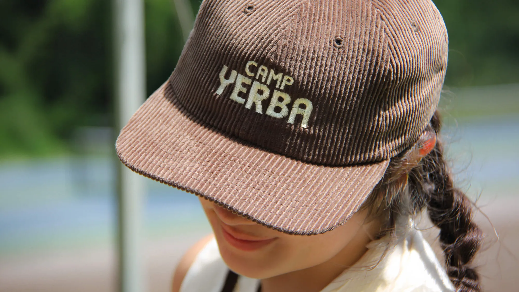 Brown corduroy Camp Yerba cap worn by a camper