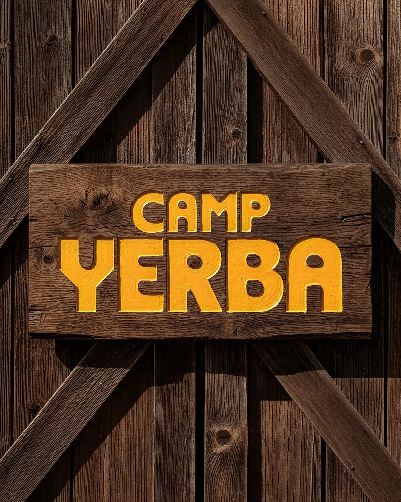 Carved wooden Camp Yerba sign on a barn door
