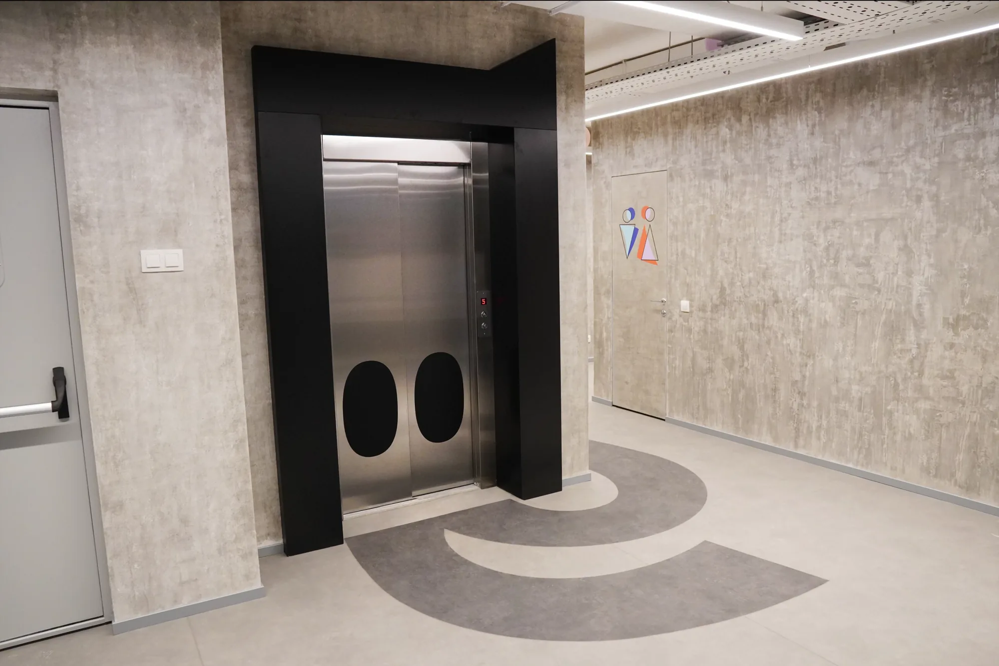 Manychat office corridor with the M on the floor