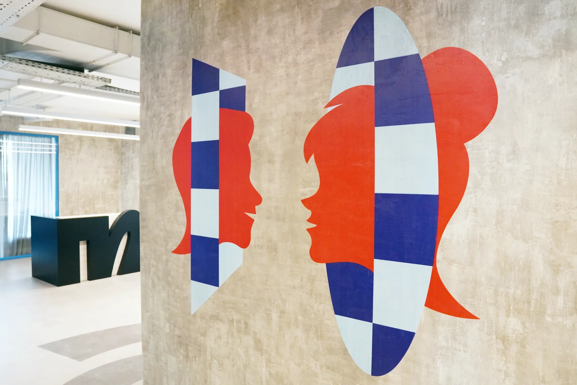 Office wall mural with checkerboard faces