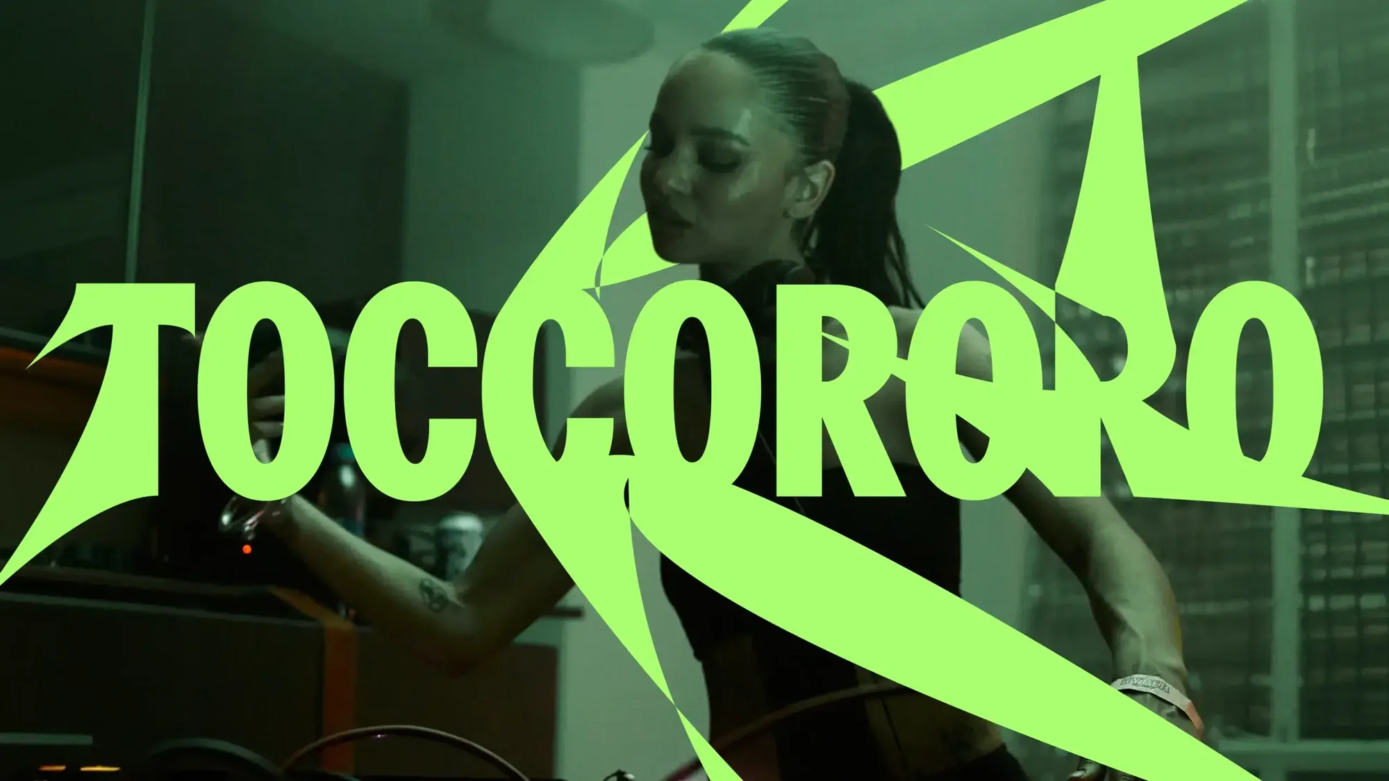 Toccororo artist graphic in lime over a DJ photo