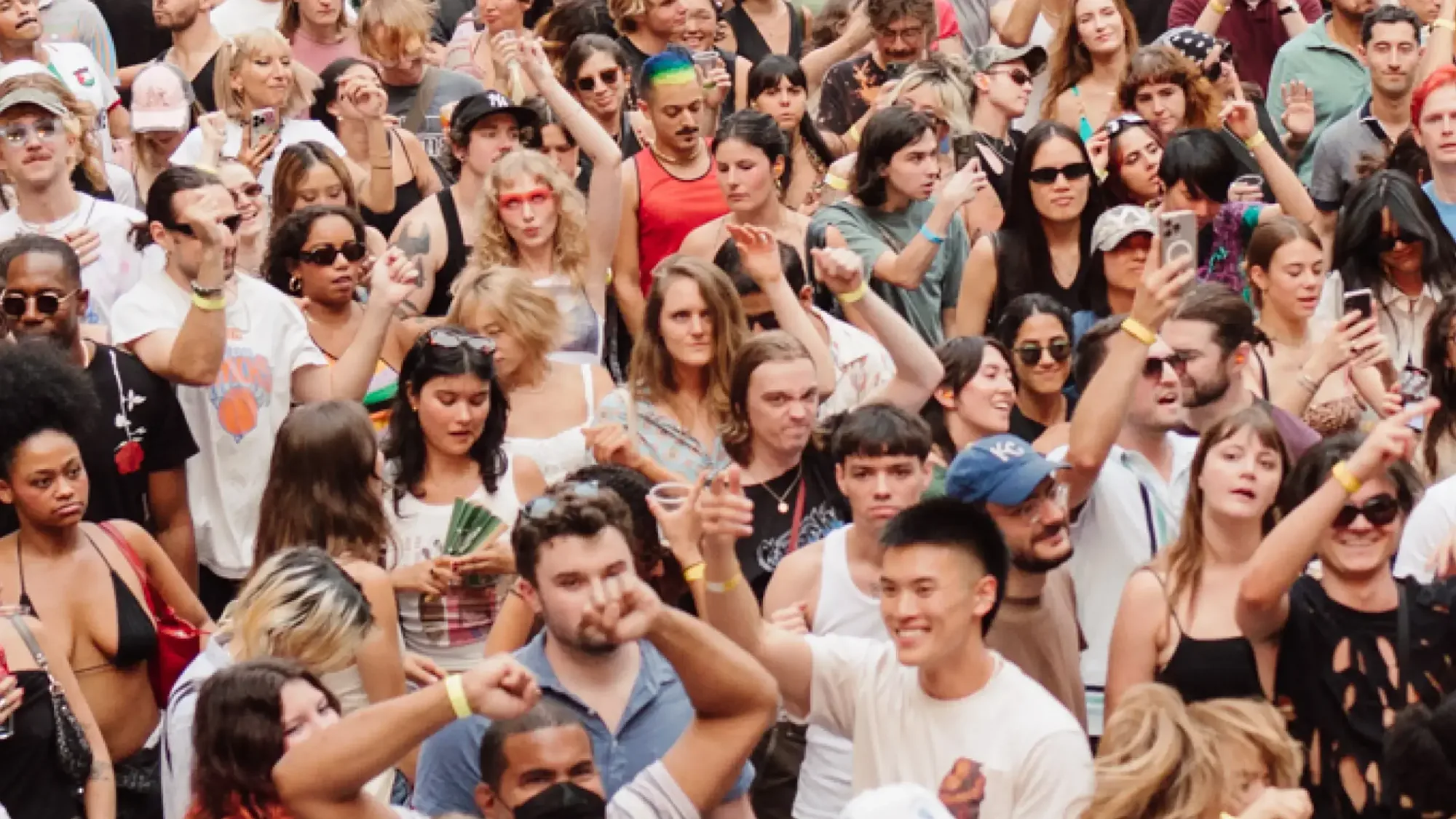 The crowd at Warm Up with hands in the air