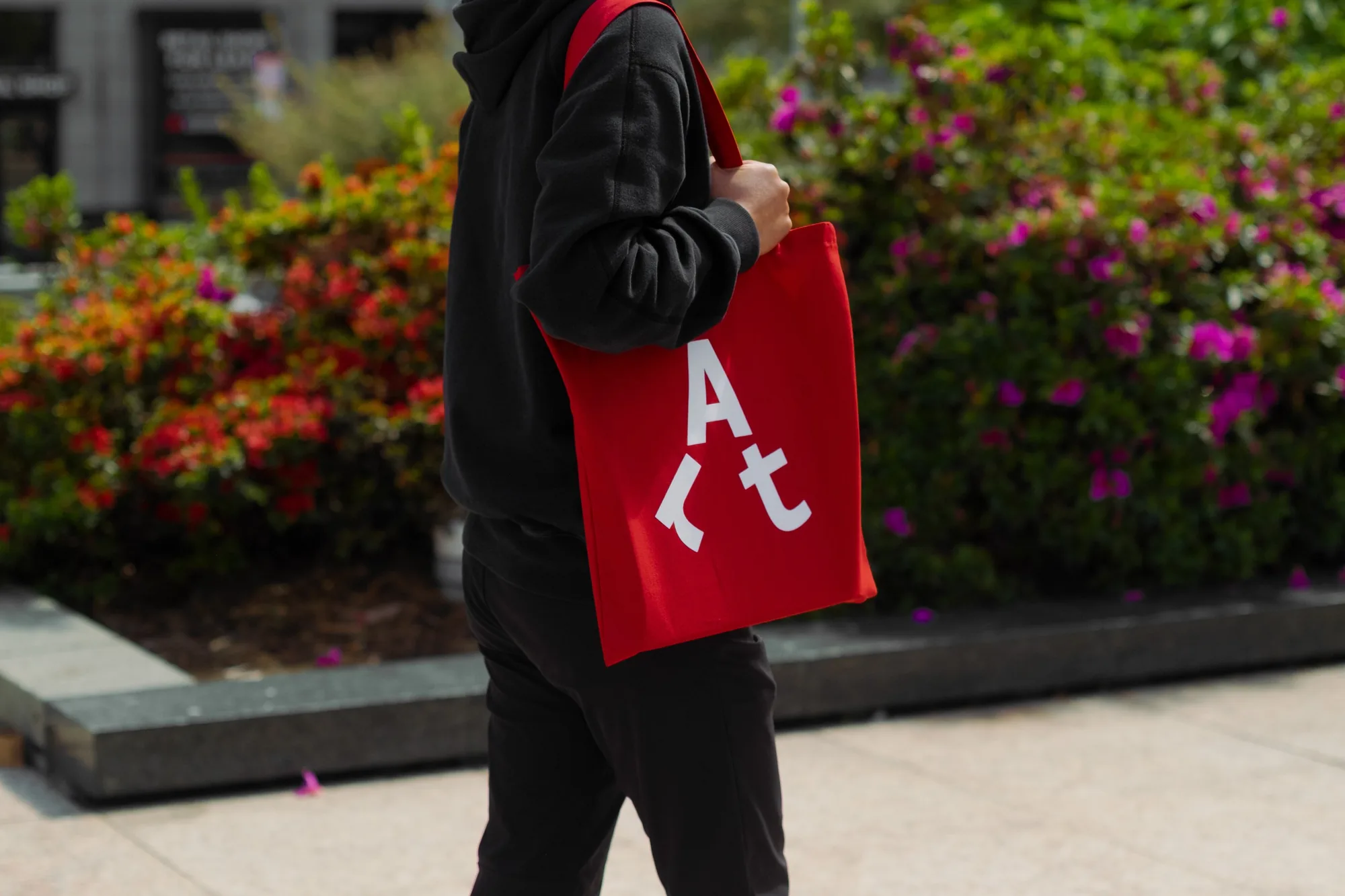 Red Piedmont Art Walk tote bag with the walking Art symbol