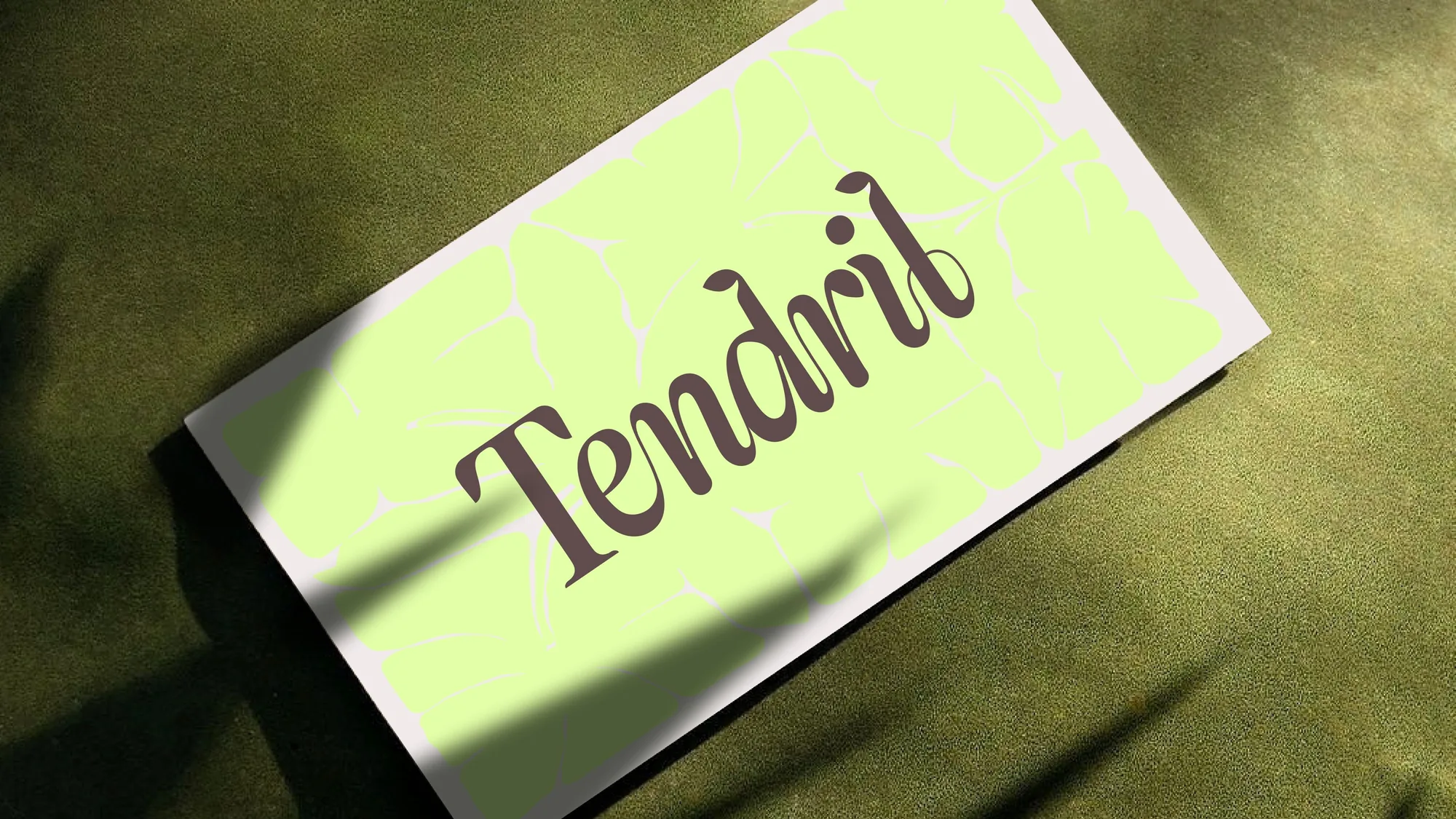 Tendril business card with the swashy serif wordmark on lime green
