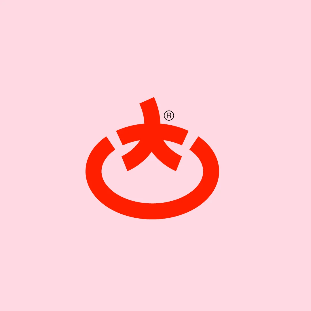 Toomato symbol, a tomato reduced to a ring and a stem, on pink