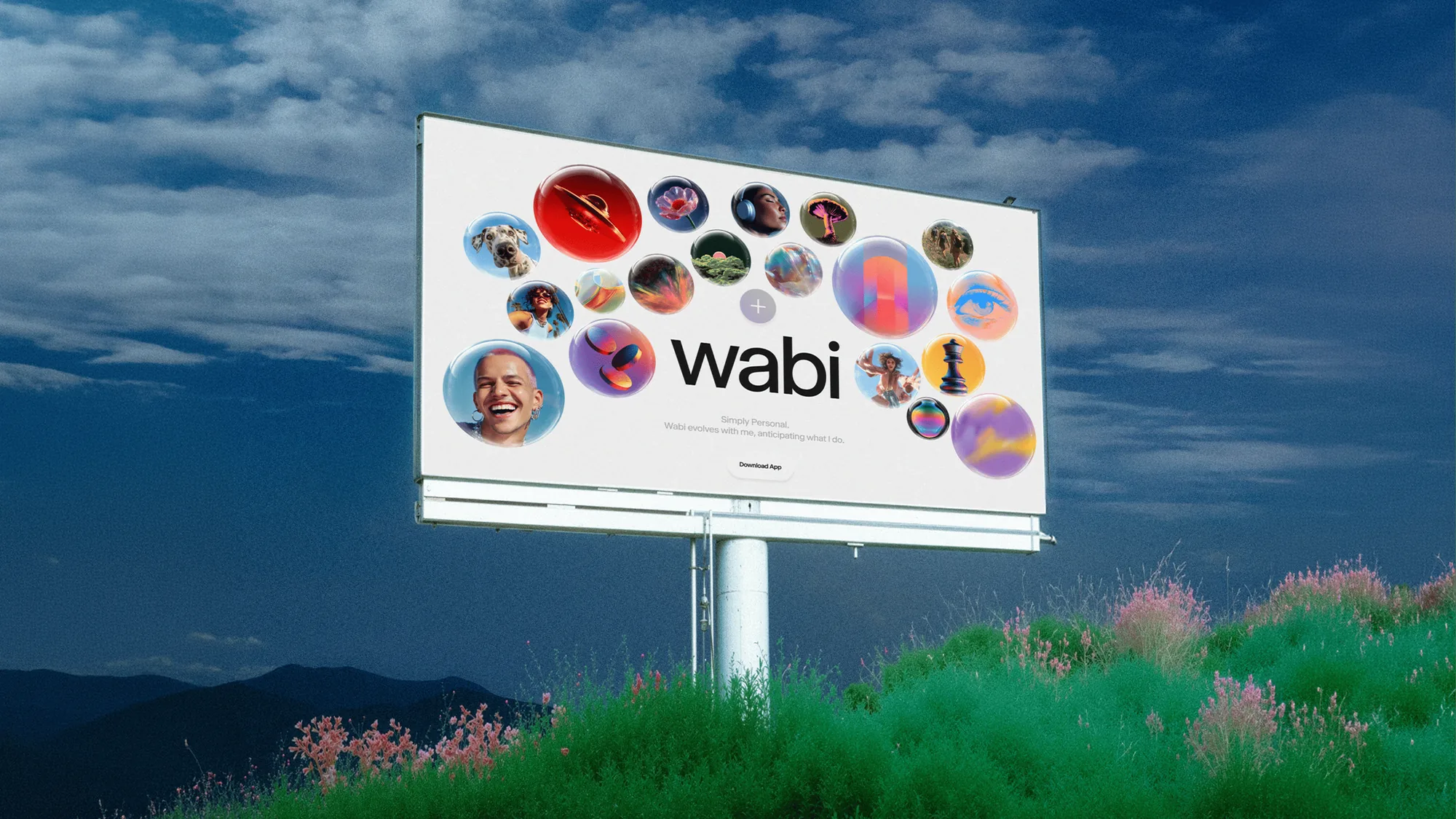 Wabi billboard full of orbits on a green hill under a blue sky