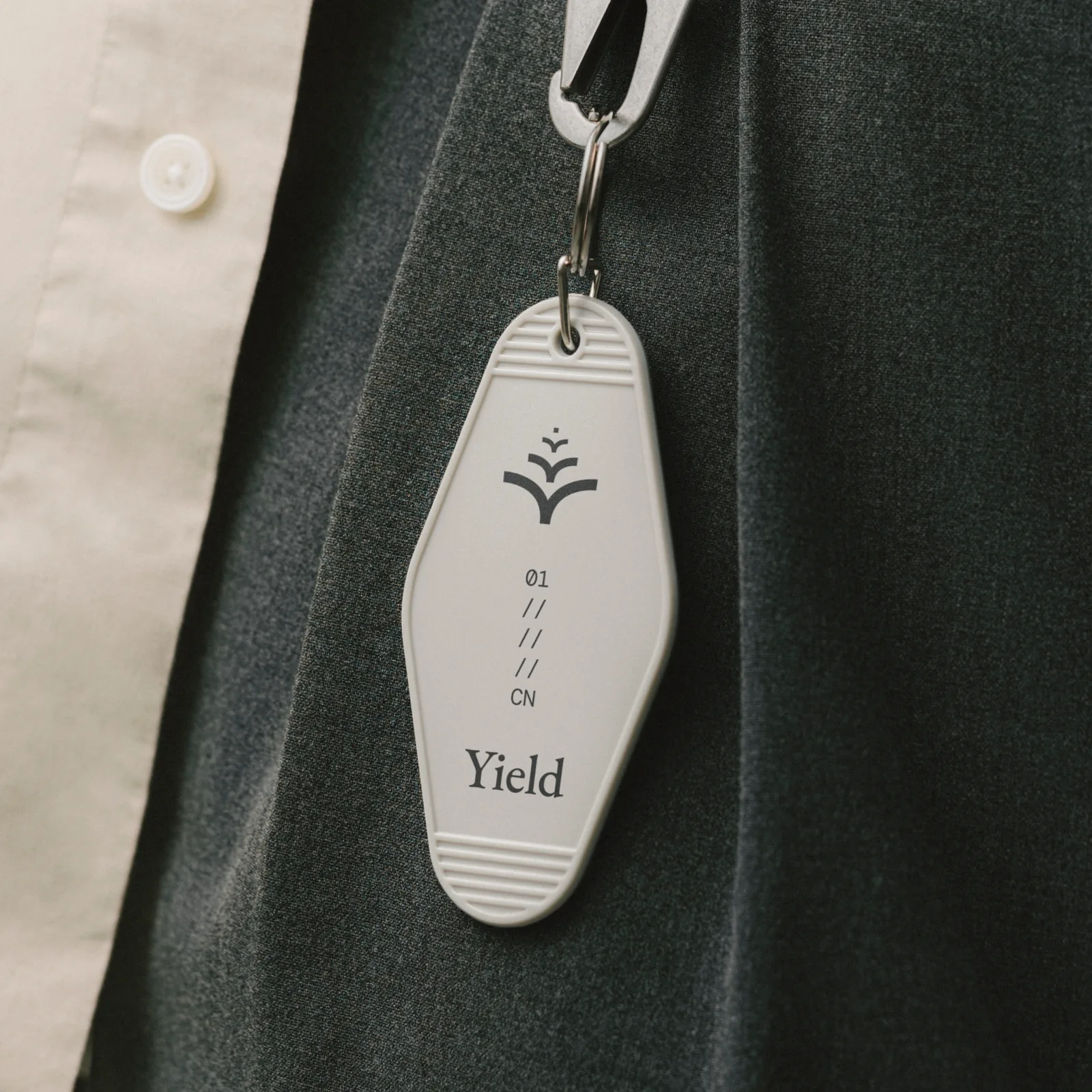 Hotel-style Yield key fob with the symbol and the edition code